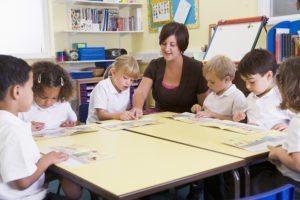 Students in class with teacher reading