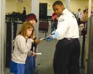 Kids going through airport security.