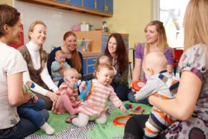 Group Of Mothers With Babies At Playgroup